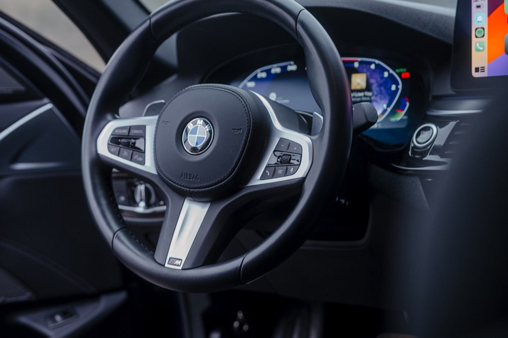 BMW M steering wheel with digital Live Cockpit instruments that you can code