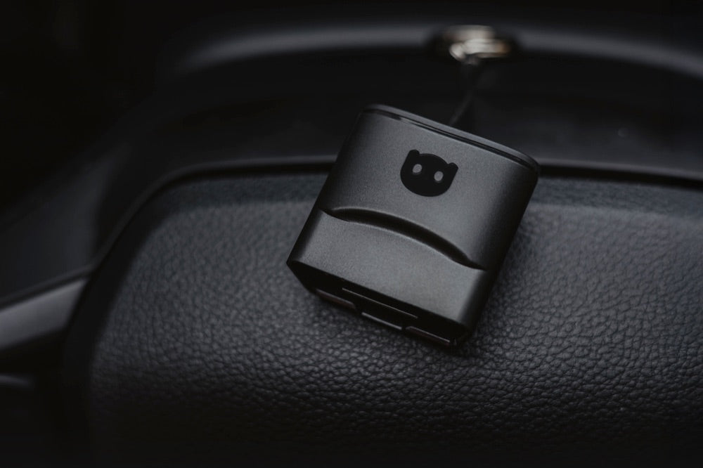 OBD2 scanner connected to the OBD2 port of a car