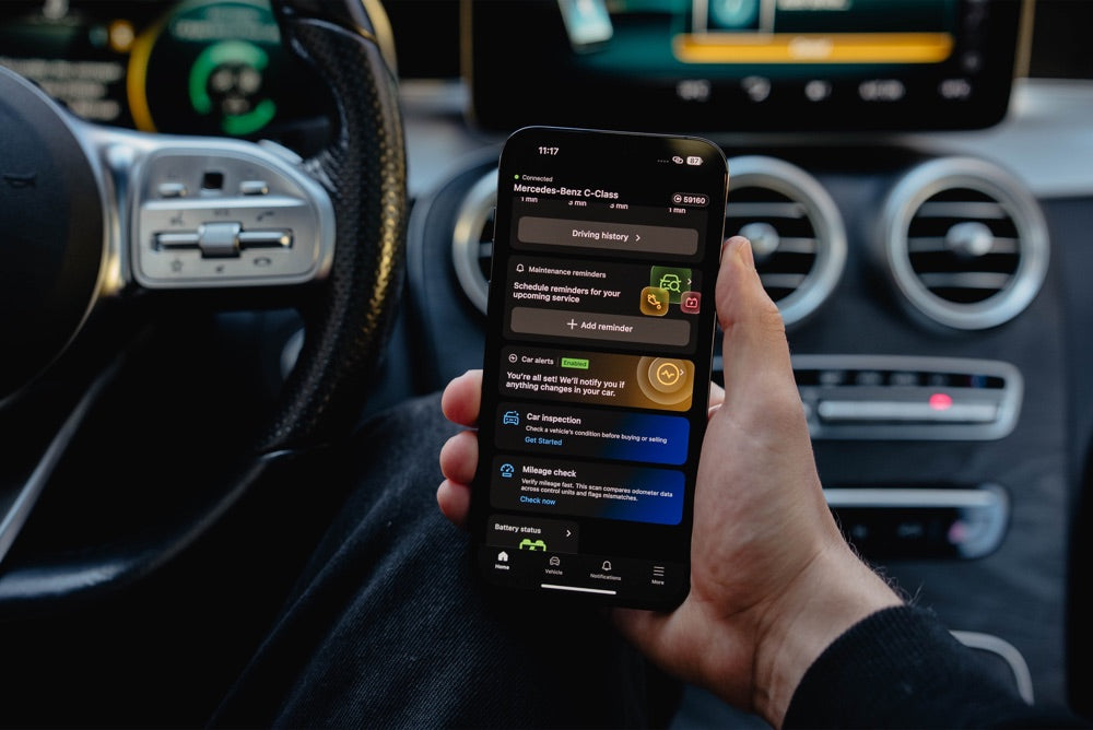 OBDeleven app shows a vehicle health report with car inspection and mileage check