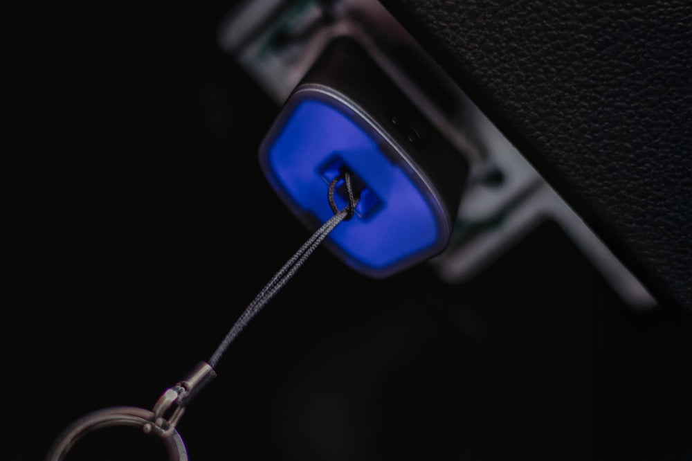 OBD2 adapter connected to the OBD2 port under the dashboard